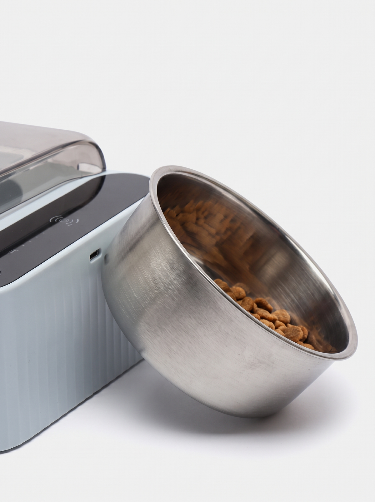 The removable stainless steel bowl lifted out of the covered cat feeder
