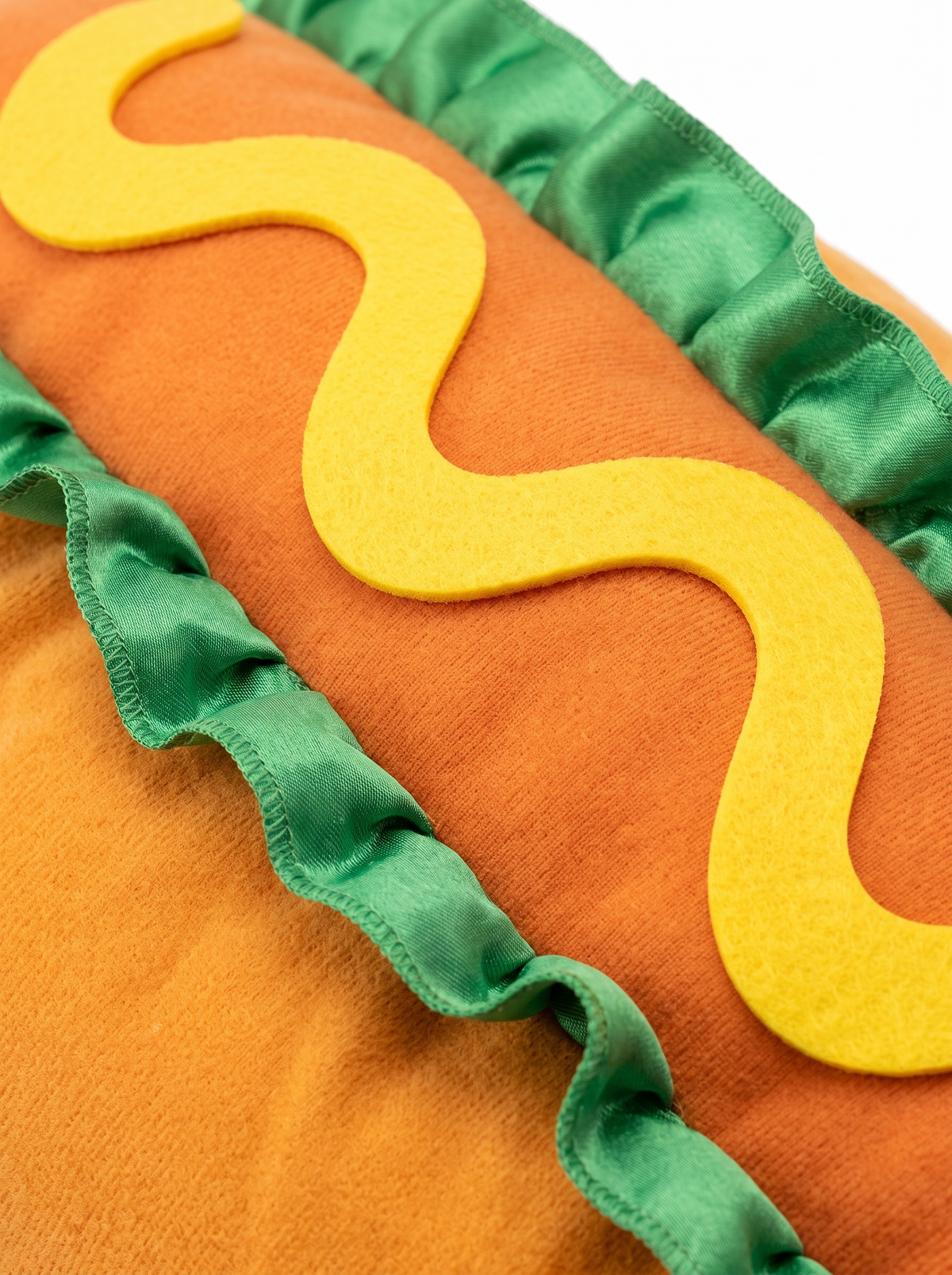 Close up of the hot dog costume bun, mustard and lettuce detail