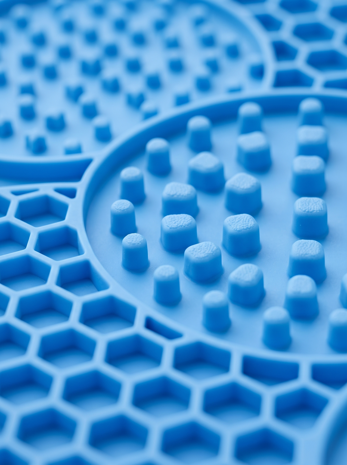 Close up of the blue silicone lick mat honeycomb texture