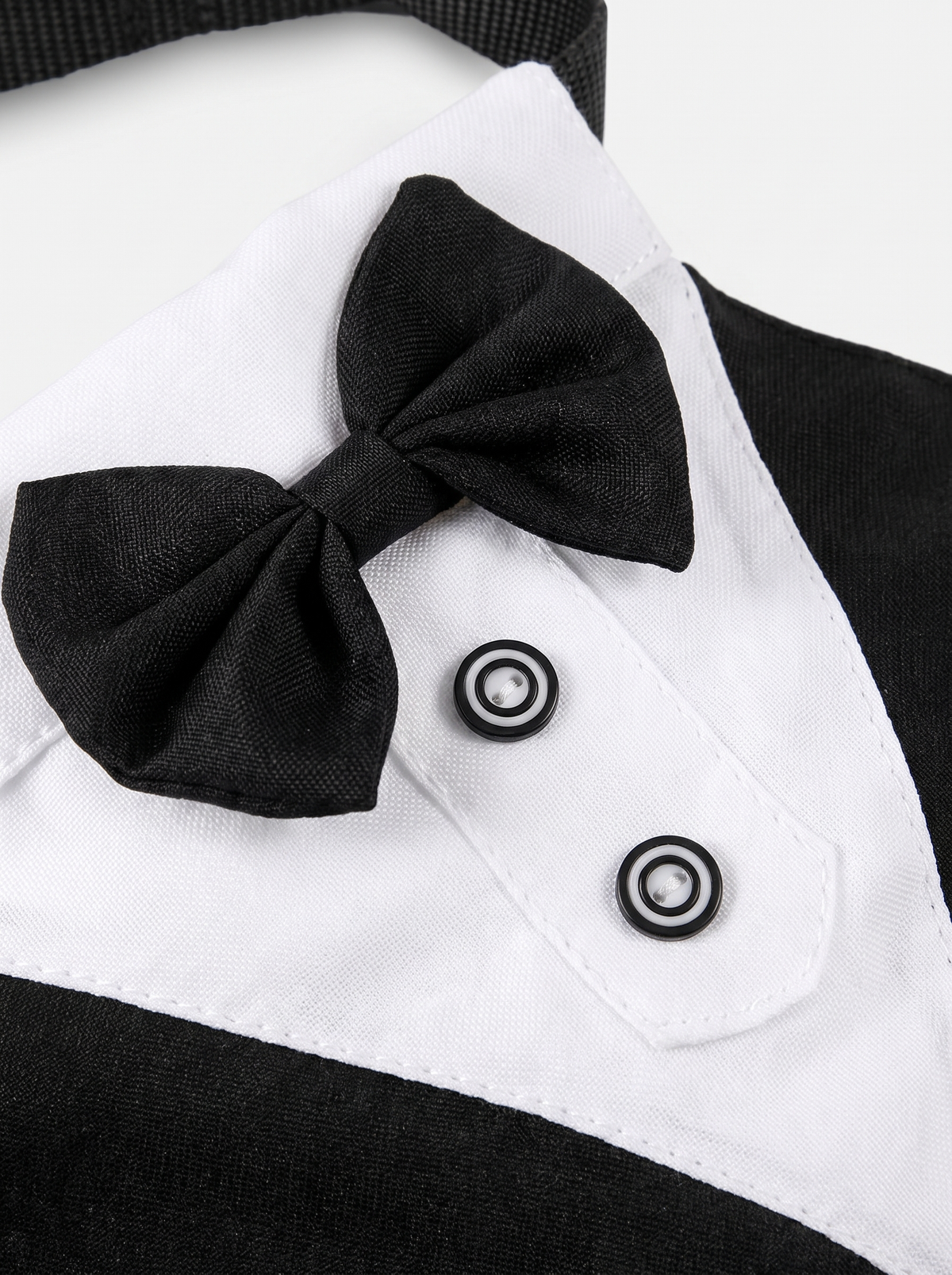 Close up of the black and white tuxedo dog bandana fabric and bow tie